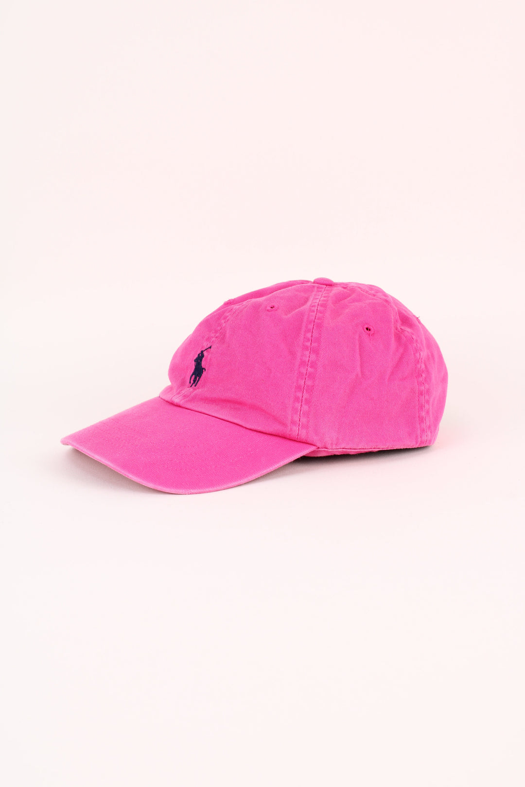 Polo Ralph Lauren Cap in a pink colourway with the logo embroidered on the front/back, and has adjustable leather strap at the back.