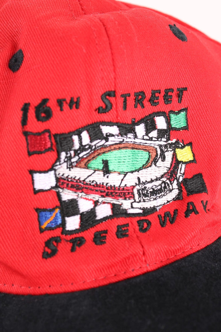 Vintage Indianapolis Motor Speedway Nascar Cap in a red and black colourway with the spell out and stadium graphic embroidered on the front, and has an adjustable strap.