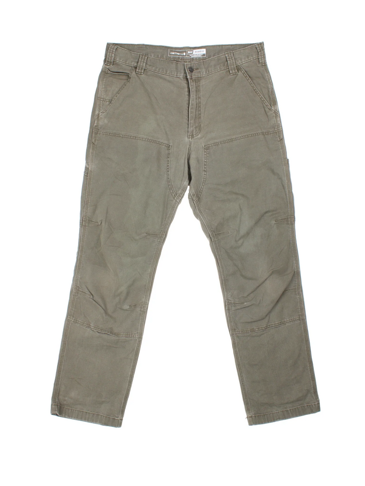 Carhartt Double Knee Trousers in a green colourway with multiple pockets and the logo embroidered on the back.