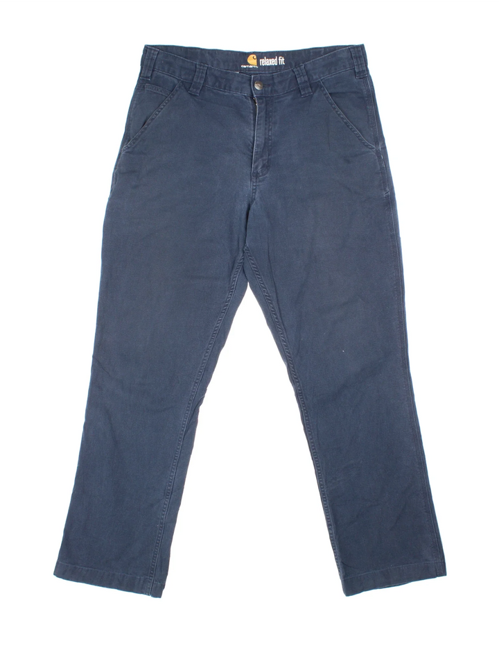 Carhartt Trousers in a blue colourway with multiple pockets and the logo embroidered on the back.