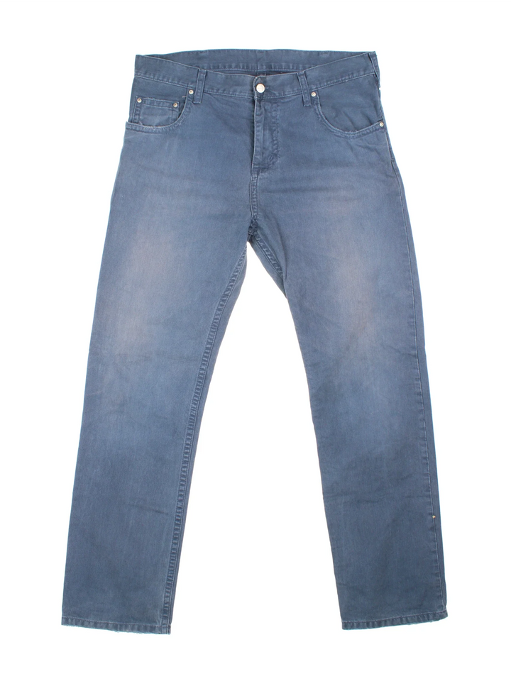 Carhartt Trousers in a blue colourway with multiple pockets and the logo embroidered on the back.