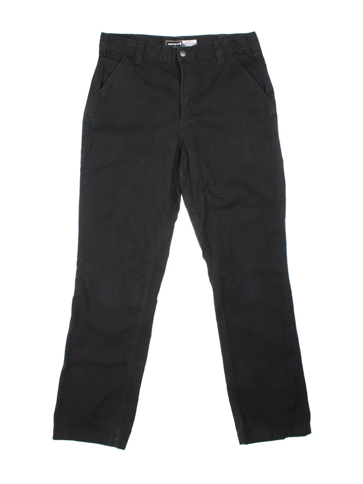 Carhartt Trousers in a black colourway with multiple pockets and the logo embroidered on the back.