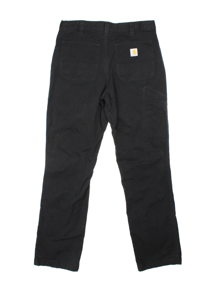 Carhartt Trousers in a black colourway with multiple pockets and the logo embroidered on the back.