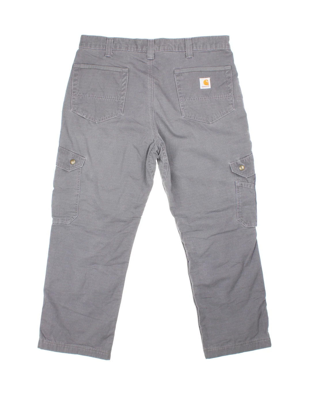 Carhartt Cargo Trousers in a grey colourway with multiple pockets, plaid pattern lining, and the logo embroidered on the back.