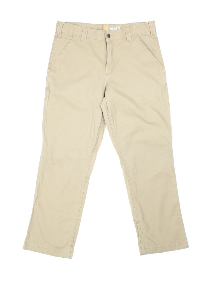 Carhartt Trousers in a tan colourway with multiple pockets and the logo embroidered on the back.