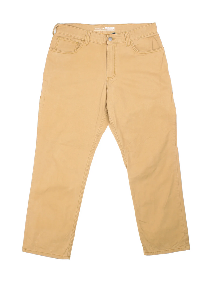 Carhartt Trousers in a tan colourway with multiple pockets and the logo embroidered on the back.