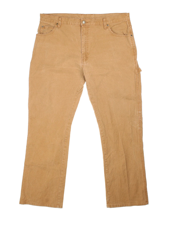 Carhartt Carpenter Trousers in a brown colourway with multiple pockets and the logo embroidered on the back.