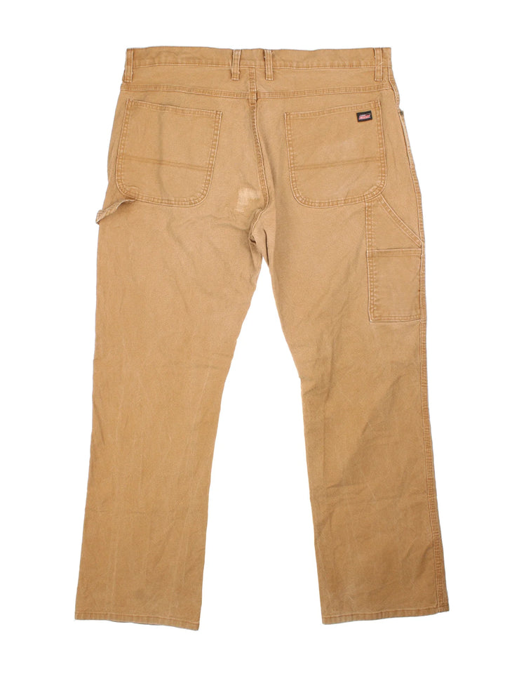 Carhartt Carpenter Trousers in a brown colourway with multiple pockets and the logo embroidered on the back.