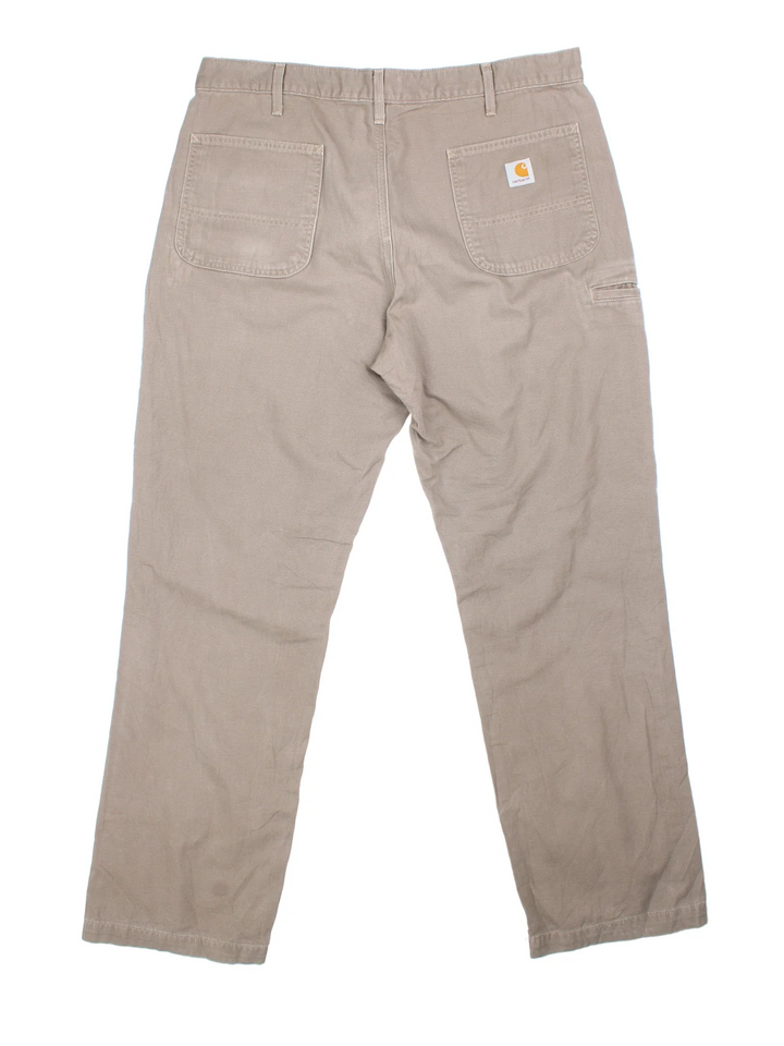 Carhartt Trousers in a brown colourway with multiple pockets and the logo embroidered on the back.