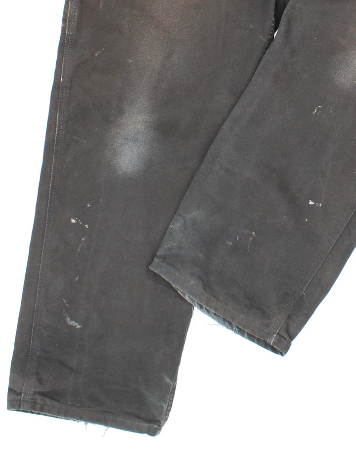 Carhartt Carpenter Jeans in a black colourway with multiple pockets and the logo embroidered on the back.