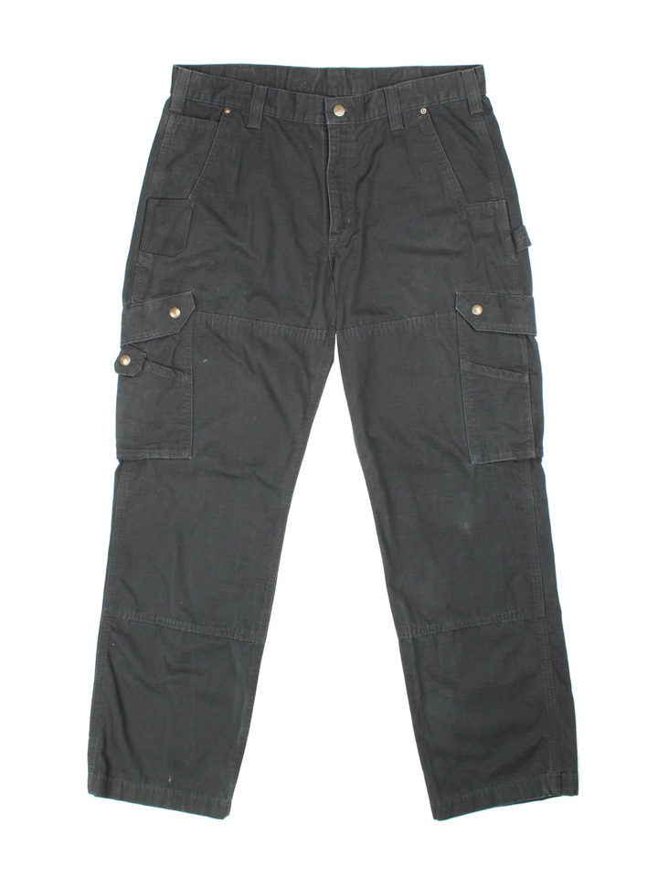 Carhartt Cargo Trousers in a black colourway with multiple pockets and the logo embroidered on the back.