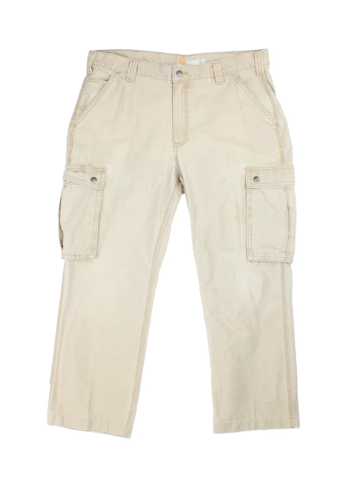 Carhartt Cargo Trousers in a tan colourway with multiple pockets and the logo embroidered on the back.