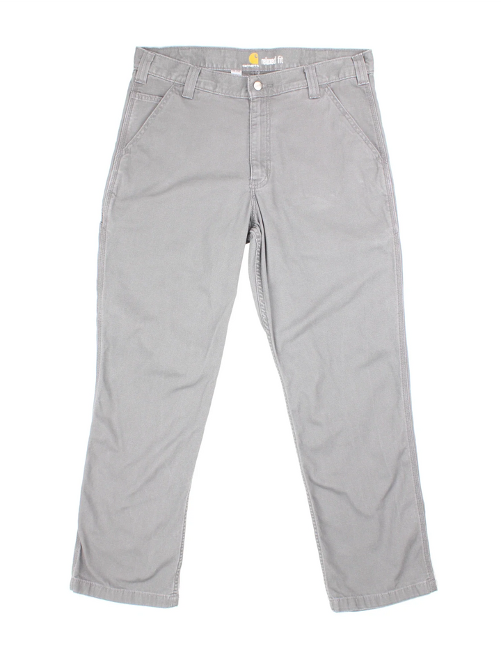 Carhartt Carpenter Trousers in a grey colourway with multiple pockets and the logo embroidered on the back.