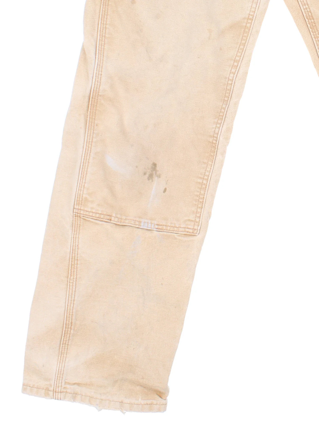 Carhartt Double Knee Jeans in a tan colourway with multiple pockets and the logo embroidered on the back.