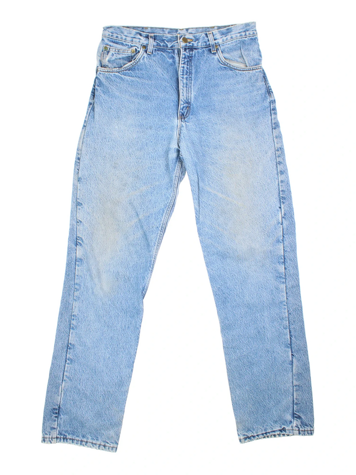 Carhartt Jeans in a blue colourway with multiple pockets, tartan lining, and the logo embroidered on the back.