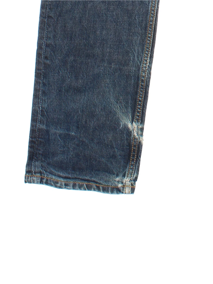 Carhartt Jeans in a blue colourway with multiple pockets and the logo embroidered on the back.