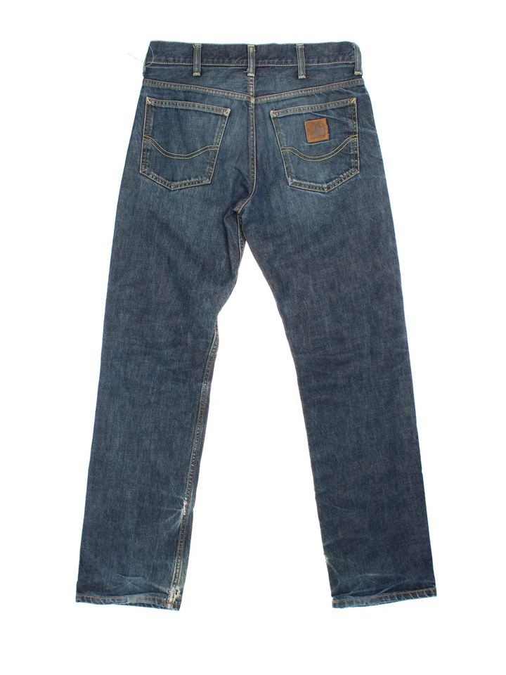 Carhartt Jeans in a blue colourway with multiple pockets and the logo embroidered on the back.