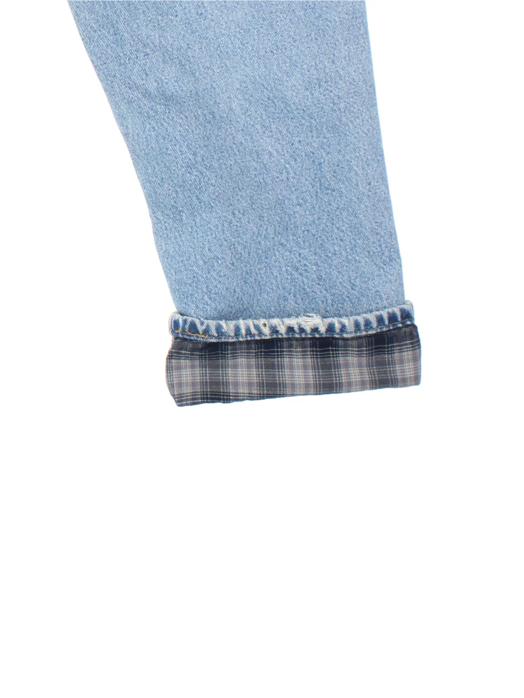Carhartt Jeans in a blue colourway with multiple pockets, plaid pattern lining, and the logo embroidered on the back.