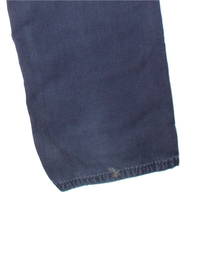 Carhartt Carpenter Trousers in a blue colourway with multiple pockets and the logo embroidered on the back.