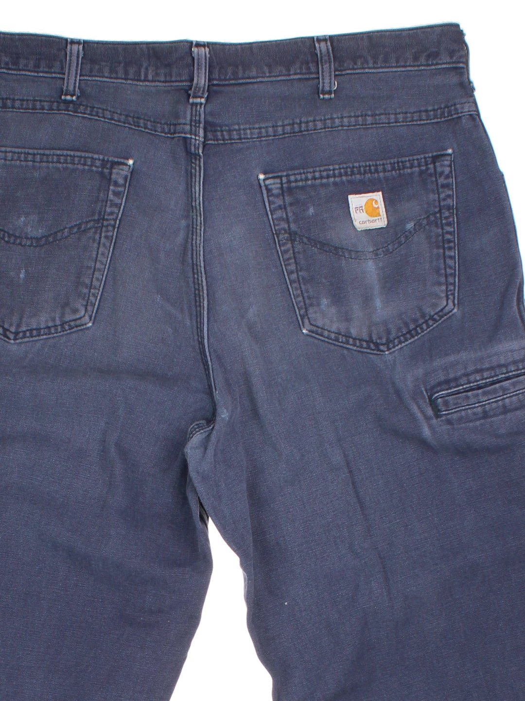 Carhartt Carpenter Trousers in a blue colourway with multiple pockets and the logo embroidered on the back.