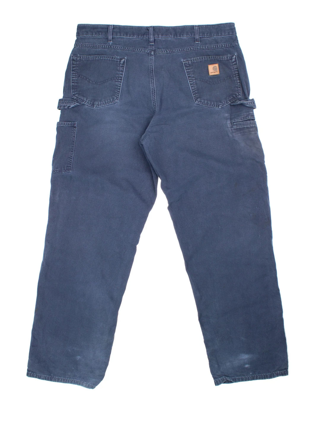 Carhartt Carpenter Trousers in a blue colourway with multiple pockets and the logo embroidered on the back.