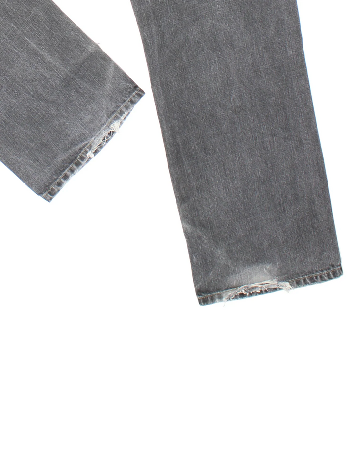 Carhartt Jeans in a grey colourway with multiple pockets and the logo embroidered on the back.