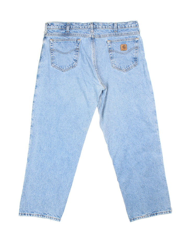 Carhartt Jeans in a blue colourway with brushed checked lining. Multiple pockets and the logo embroidered on the back.