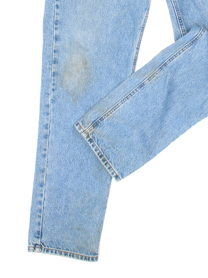 Carhartt Jeans in a blue colourway with multiple pockets and the logo embroidered on the back.