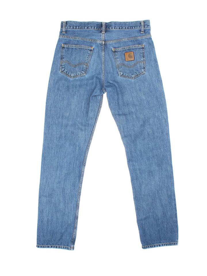 Carhartt Jeans in a blue colourway with multiple pockets and the logo embroidered on the back.