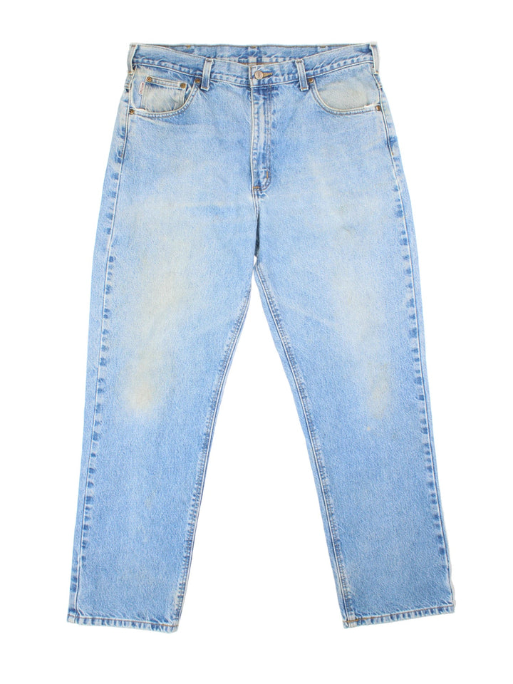 Carhartt Jeans in a blue colourway with multiple pockets and the logo embroidered on the back.