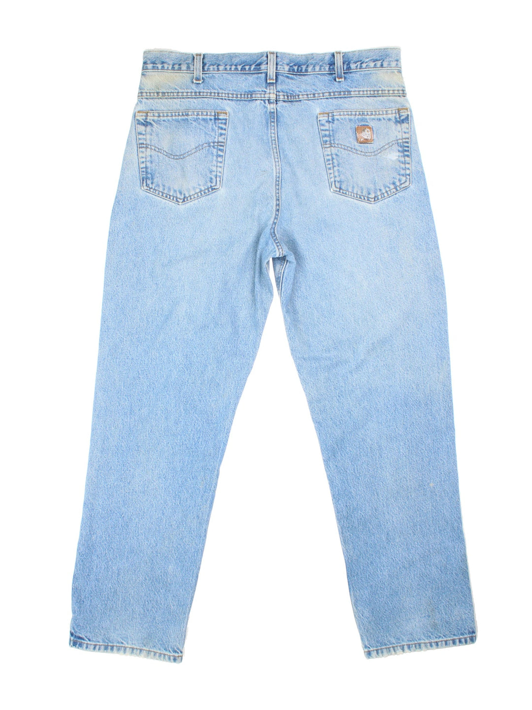 Carhartt Jeans in a blue colourway with multiple pockets and the logo embroidered on the back.