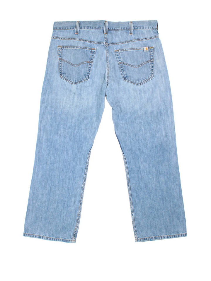 Carhartt Jeans in a blue colourway with multiple pockets and the logo embroidered on the back.