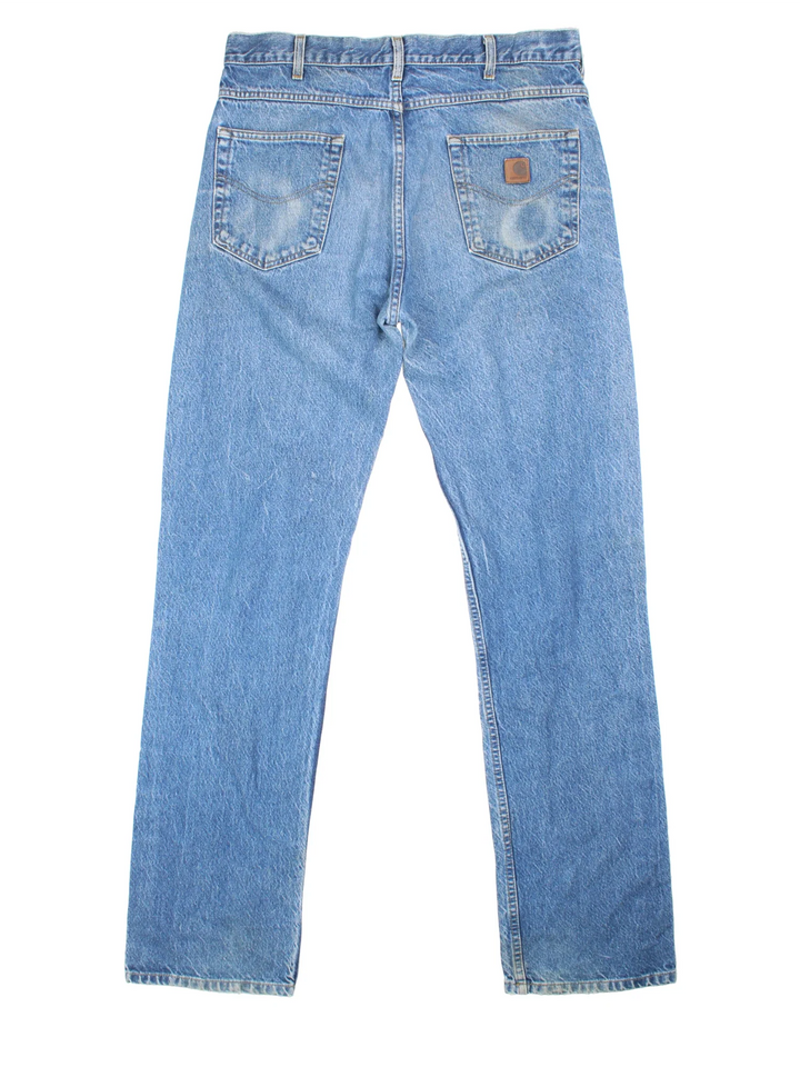 Carhartt Jeans in a blue colourway with multiple pockets and the logo embroidered on the back.