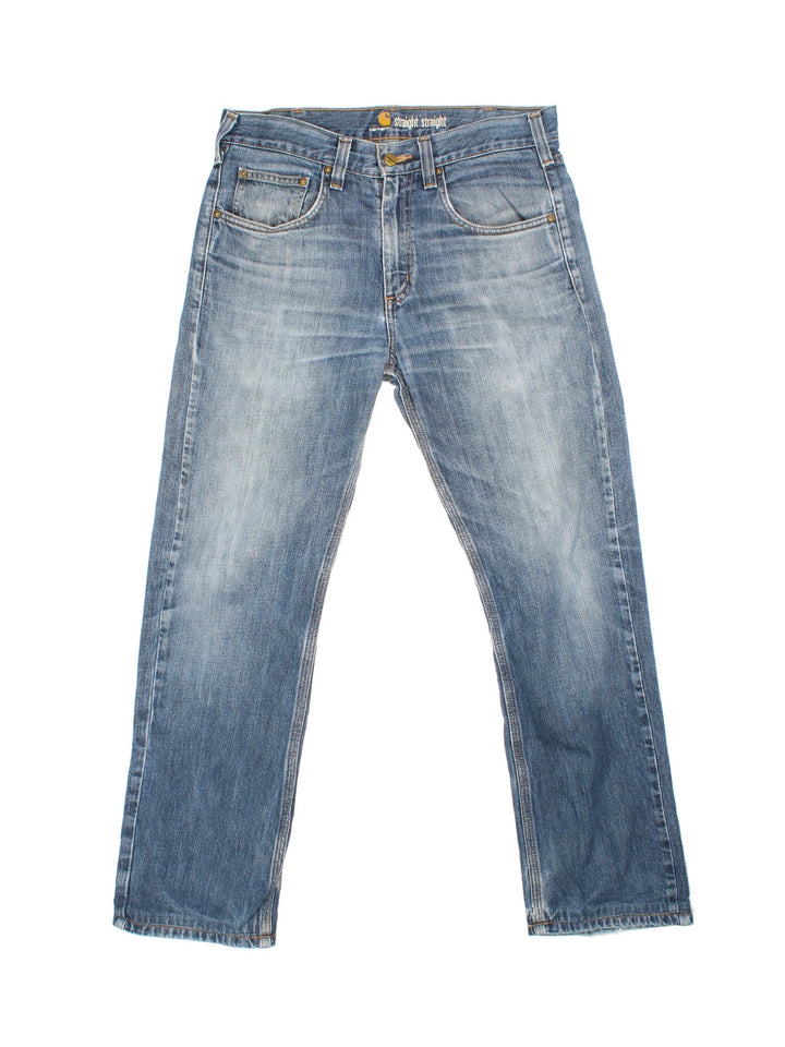 Carhartt Jeans in a blue colourway with multiple pockets and the logo embroidered on the back.