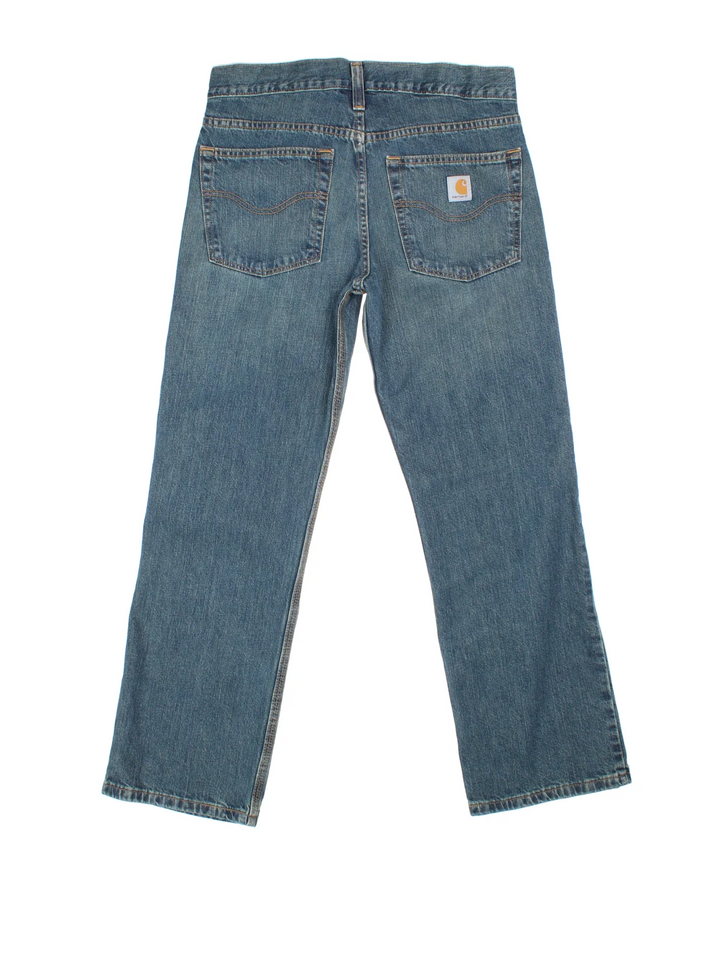 Carhartt Jeans in a blue colourway with multiple pockets and the logo embroidered on the back.