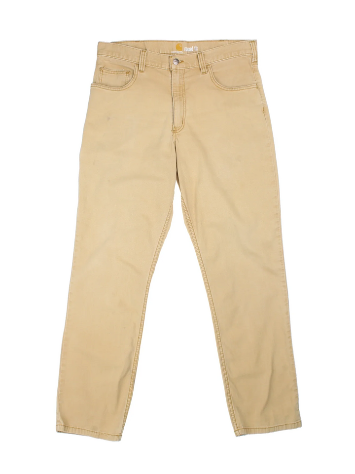 Carhartt Trousers in a tan colourway with multiple pockets and the logo embroidered on the back.