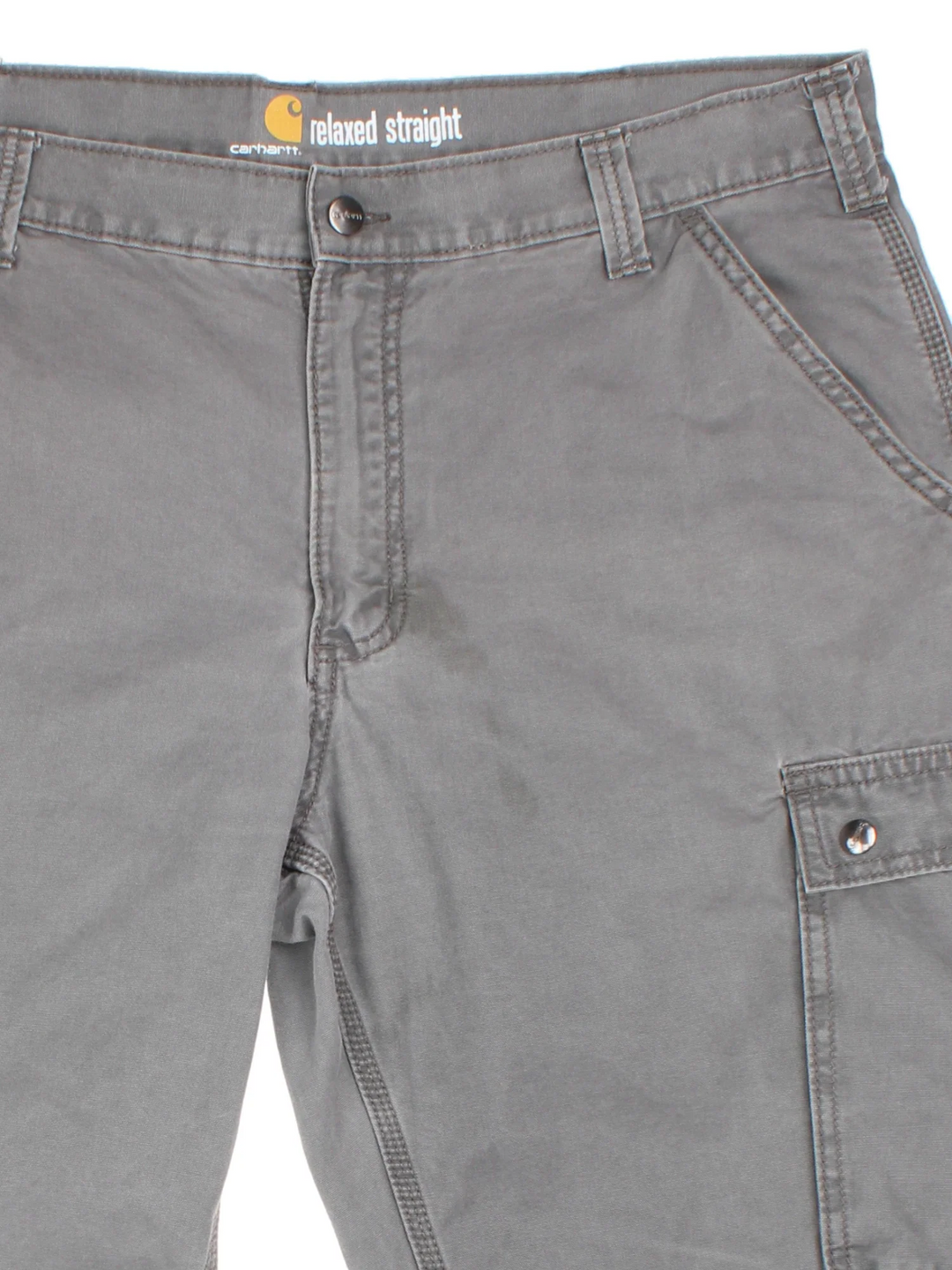 Carhartt Trousers in a grey colourway with multiple pockets and the logo embroidered on the back.