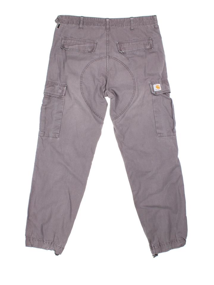 Carhartt Cargo Trousers in a grey colourway with multiple pockets and the logo embroidered on the back.