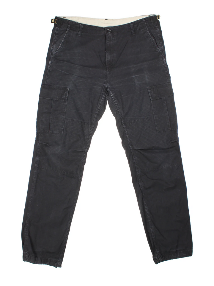 Carhartt Cargo Trousers in a black colourway with multiple pockets and the logo embroidered on the back.