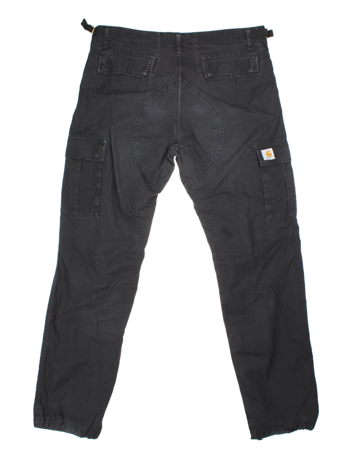 Carhartt Cargo Trousers in a black colourway with multiple pockets and the logo embroidered on the back.