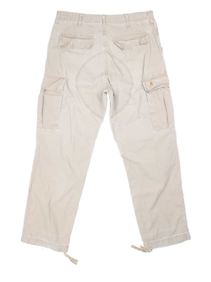 Carhartt Cargo Trousers in a tan colourway with multiple pockets and the logo embroidered on the back.