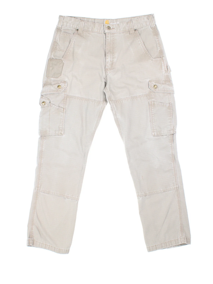 Carhartt Cargo Trousers in a tan colourway with multiple pockets and the logo embroidered on the back.