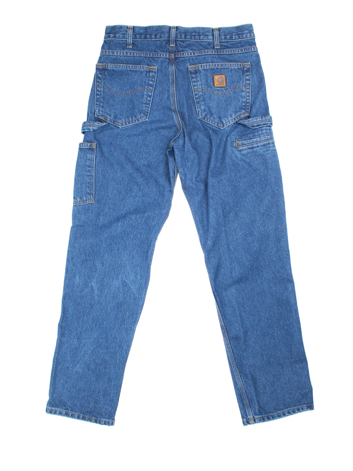 Carhartt Carpenter Jeans in a blue colourway with multiple pockets and the logo embroidered on the back.