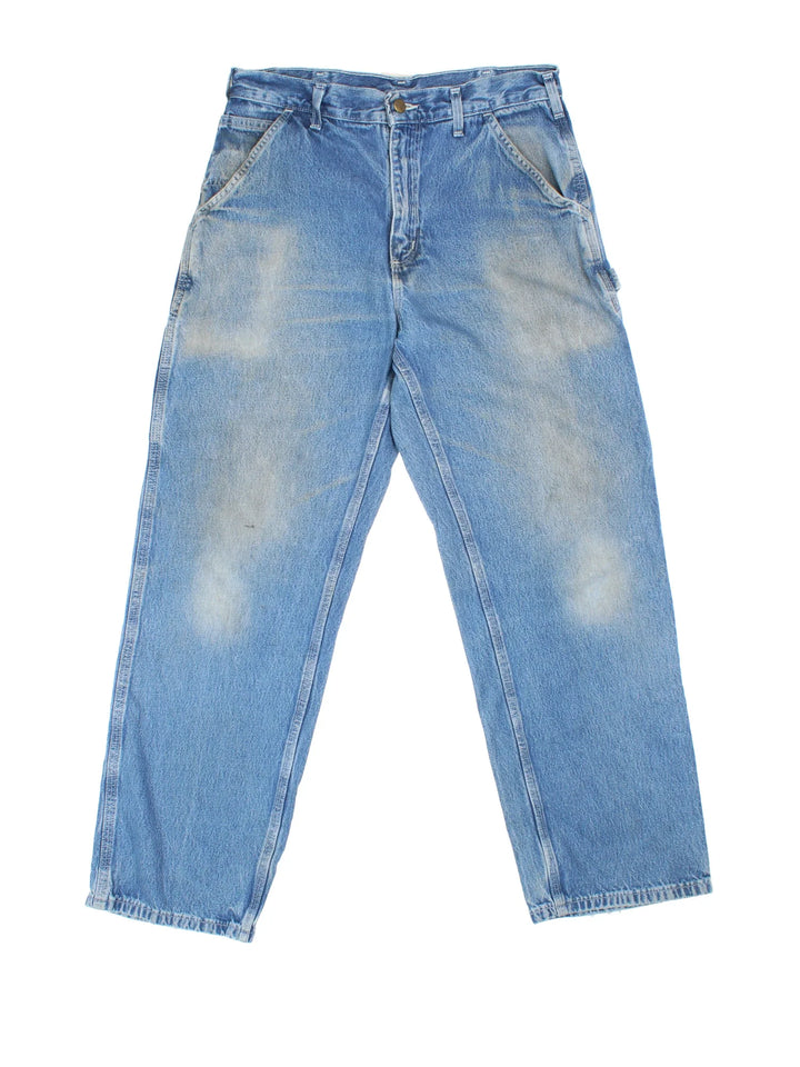 Carhartt Carpenter Jeans in a blue colourway with multiple pockets and the logo embroidered on the back.