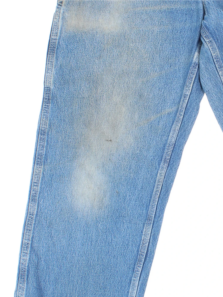 Carhartt Carpenter Jeans in a blue colourway with multiple pockets and the logo embroidered on the back.