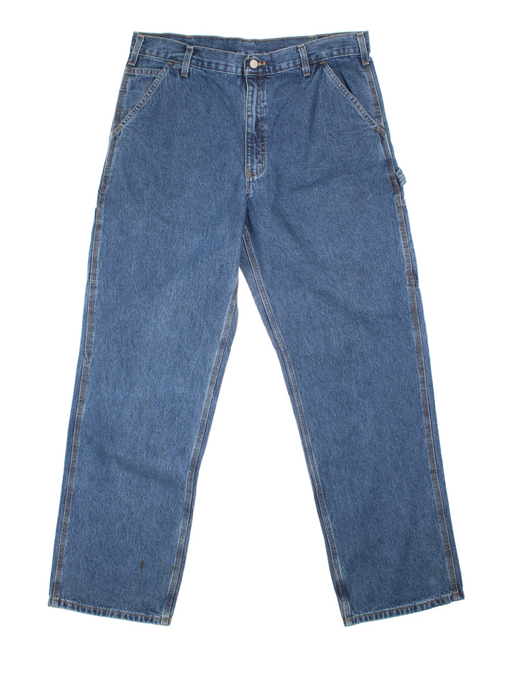 Carhartt Carpenter Jeans in a blue colourway with multiple pockets and the logo embroidered on the back.