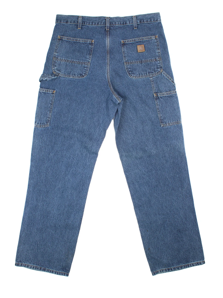Carhartt Carpenter Jeans in a blue colourway with multiple pockets and the logo embroidered on the back.