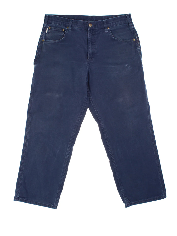 Carhartt Carpenter Jeans in a blue colourway with multiple pockets and the logo embroidered on the back.