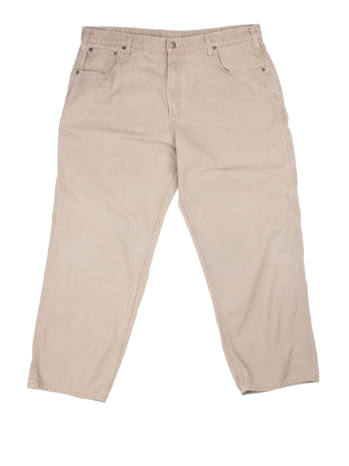 Carhartt Carpenter Jeans in a tan colourway with multiple pockets and the logo embroidered on the back.