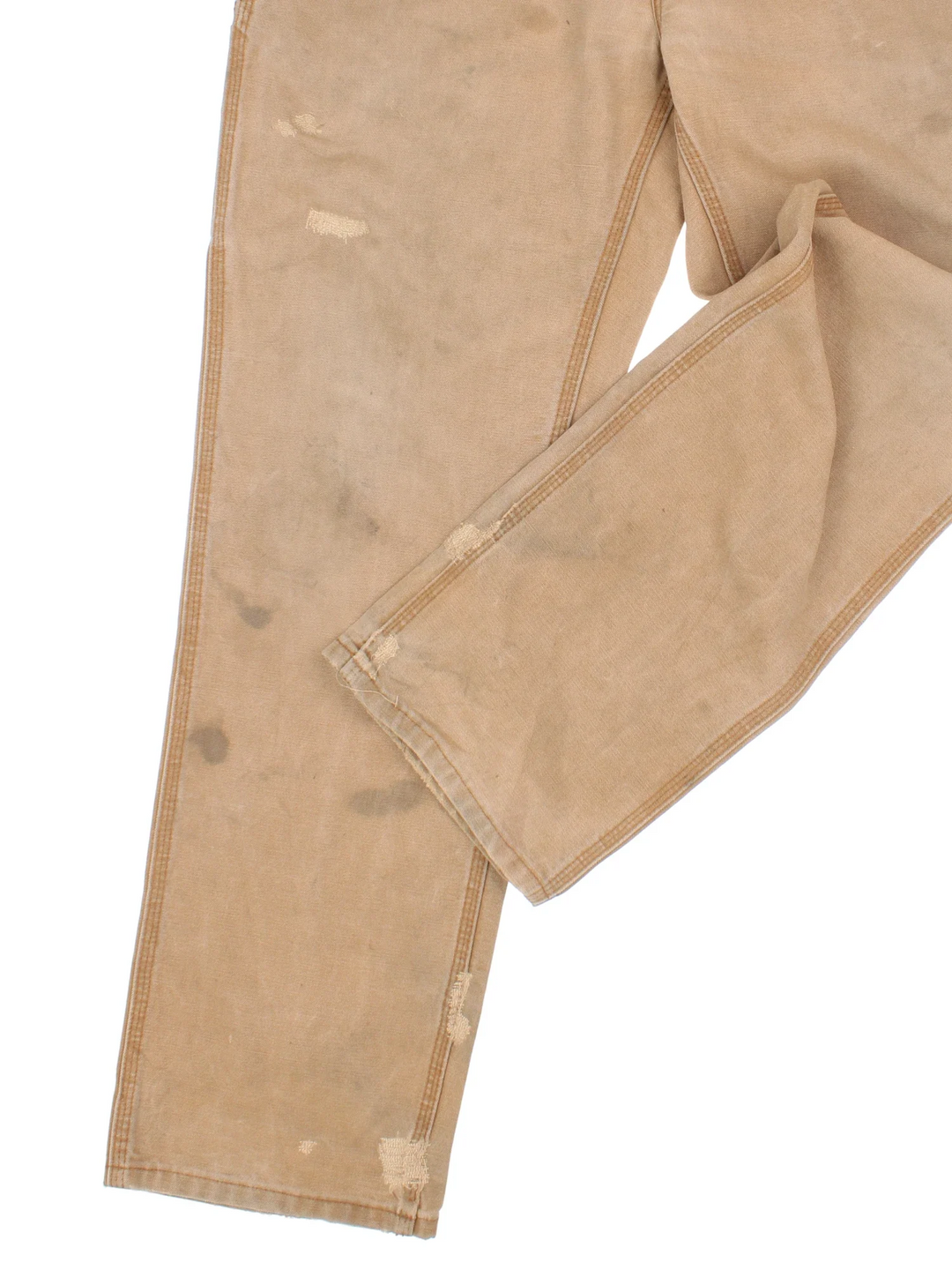 Carhartt Carpenter Jeans in a tan colourway with multiple pockets and the logo embroidered on the back.